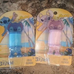 Stitch slinkies. One pink and one blue in the set brand new with tags